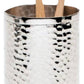 A silver, hand-hammered metal cup from the Pigeon & Poodle Verum Bath Collection holds two bamboo toothbrushes with white bristles.