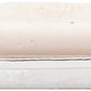 A light-hued rectangular soap sits in a hand-hammered silver dish from Pigeon & Poodle’s Verum Bath Collection, bringing artisanal elegance to your bathroom.