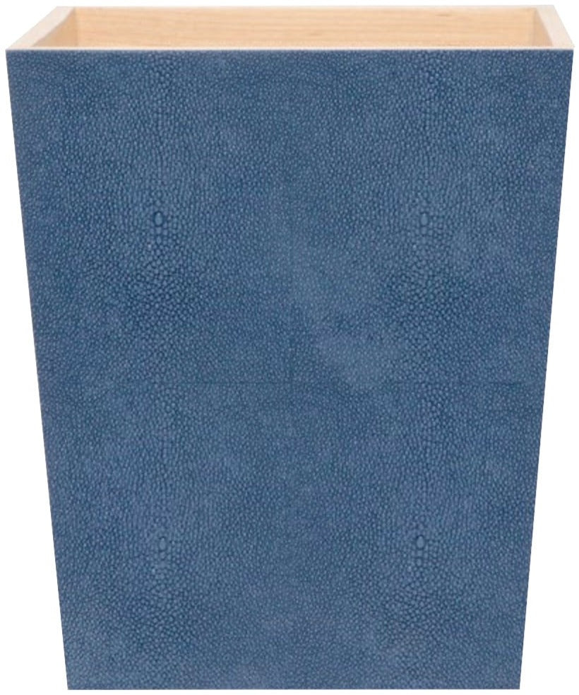 The Manchester Bath Collection by Pigeon & Poodle features a blue, square, textured box with a subtle shagreen finish and open top, revealing a light interior when viewed from the front.