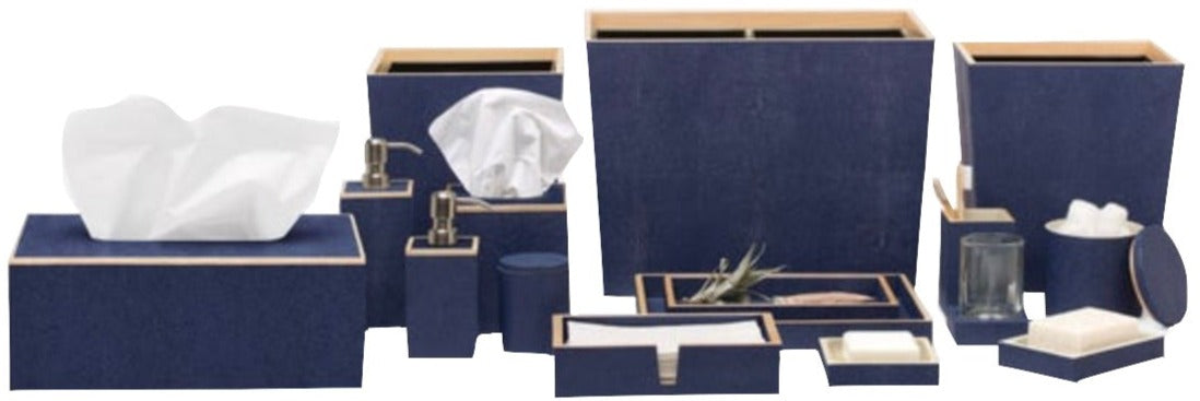 The Manchester Bath Collection by Pigeon & Poodle features blue bathroom accessories with a chic shagreen texture—tissue boxes, dispensers, trays, waste bins, cups, soap dishes, and a lidded container—all displayed on a white background.