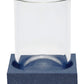 A clear glass dome from the Manchester Bath Collection by Pigeon & Poodle stands upright on a textured blue rectangular base featuring a subtle shagreen finish and circular indentation.