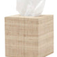 A single tissue protrudes from the beige, textured Ghent Bath Collection tissue box by Pigeon & Poodle, adding seaside-chic charm to any bathroom.