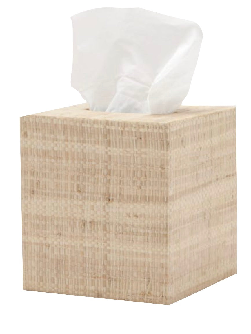 A single tissue protrudes from the beige, textured Ghent Bath Collection tissue box by Pigeon & Poodle, adding seaside-chic charm to any bathroom.