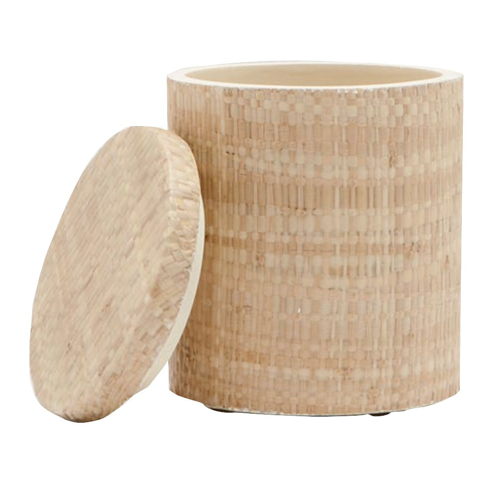 The Ghent Bath Collection by Pigeon & Poodle features a cylindrical woven grass basket with an open lid, revealing a light interior and textured exterior—ideal for adding seaside-chic style to your bathroom.