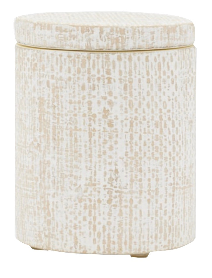 The Ghent Bath Collection by Pigeon & Poodle features a round, beige and white textured ottoman with a removable lid and small feet, adding seaside-chic style to any space.