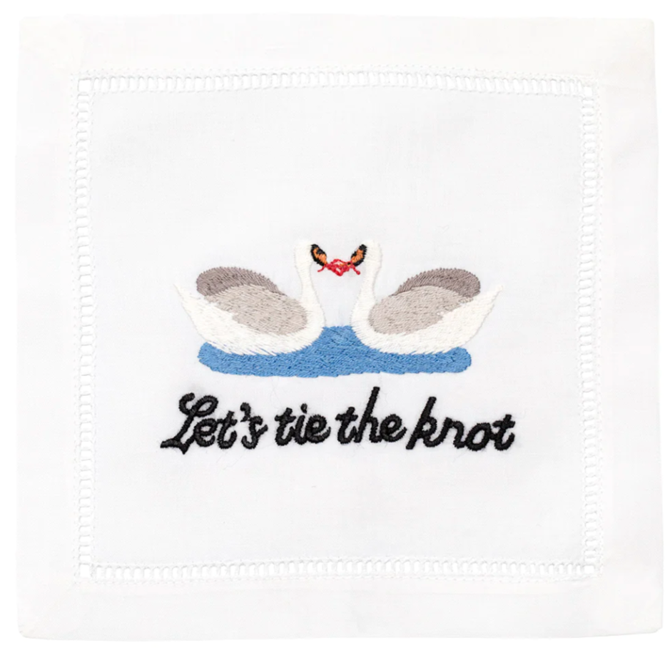 The Let's Tie The Knot Cocktail Napkins by August Morgan feature two swans above blue water with a red bow and "Let's tie the knot" text—an elegant embroidered cotton napkin, perfect for weddings.