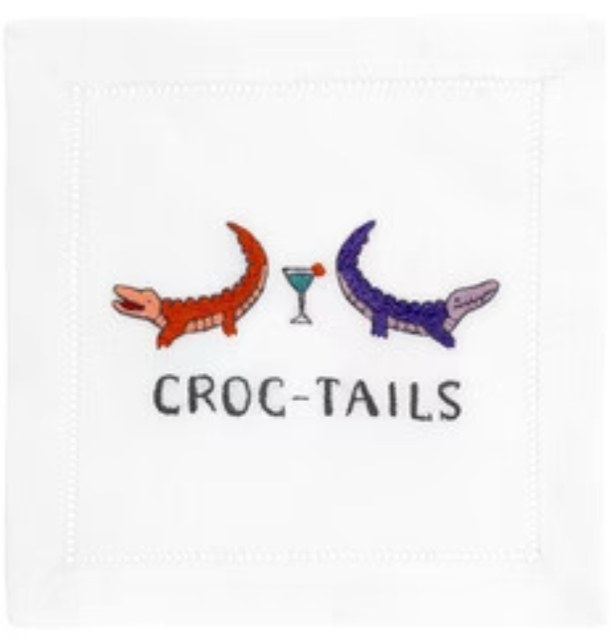 The August Morgan Cocktail Napkins, "Croc-Tails," feature two elegant crocodiles facing each other with a cocktail glass between them, capturing both sophistication and whimsy.