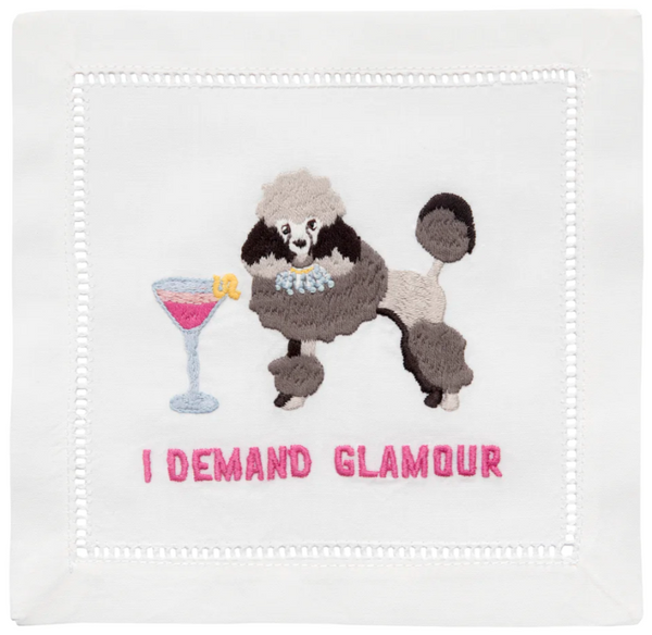 Embroidered image of a poodle with a cocktail glass and the phrase "i demand glamour" on a set of August Morgan Cocktail Napkins I Demand Glamour, Set of 4.