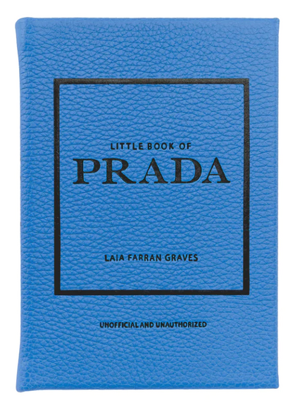 A blue book titled "Little Book of Prada" by Graphic Image, labeled as unofficial and unauthorized, details the history of the luxury fashion house.