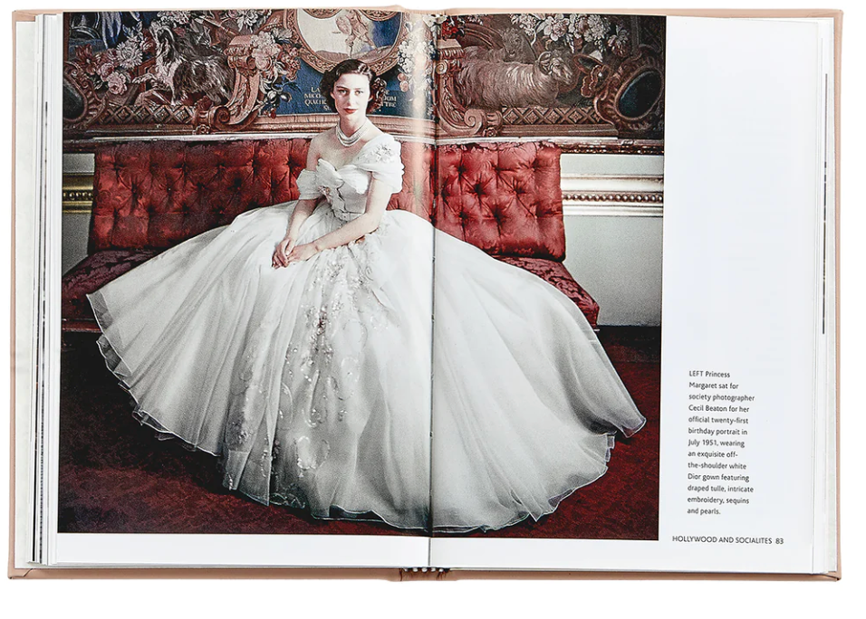 An open book titled "Little Book of Dior" by Graphic Image features a photograph of a woman in an elaborate white gown, capturing the essence of Parisian haute couture's new look silhouette. She is seated on a red velvet couch against an ornate backdrop, embodying the elegance synonymous with Christian Dior. Text and image credits are located on the lower right page.