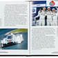 An open book titled "The Story Of Porsche Black Leather" by Graphic Image features a race car and drivers in uniform. It narrates Porsche's return to top-level racing, highlighting the luxury and innovation of its LMP1 hybrid vehicle with style and speed.