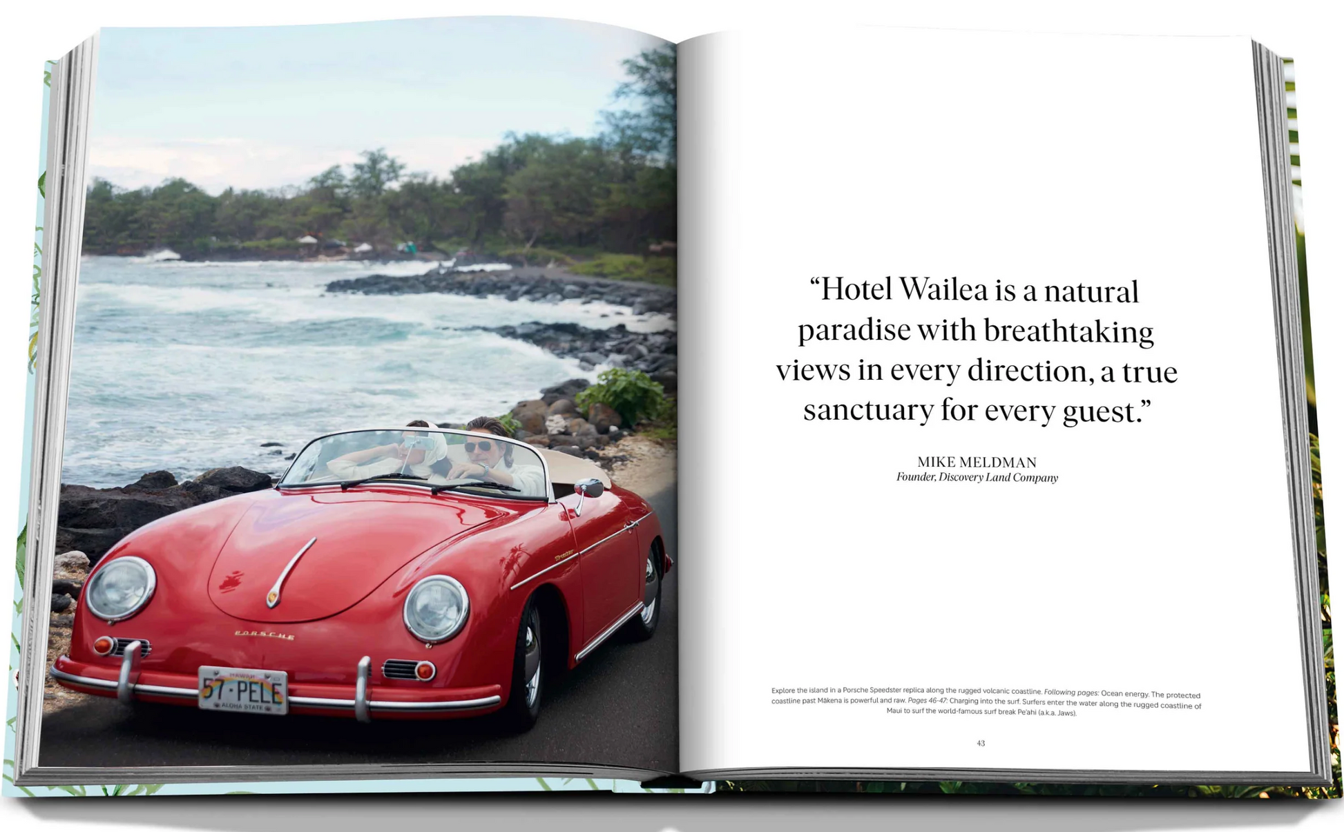 An open book showcasing a red vintage car cruising along a scenic coastal road lies next to a page featuring a quote from Mike Meldman about the breathtaking views at Hotel Wailea. This beautifully encapsulates the essence of your Hawaiian-island escape at this boutique resort, all brought to you by Assouline.