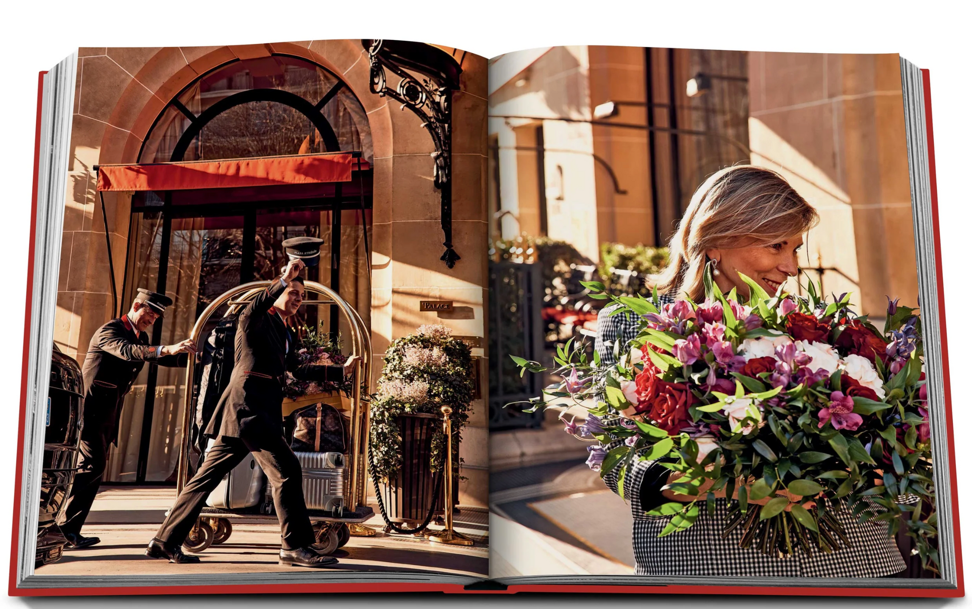 A woman holding a large bouquet of flowers walks past a doorman and bellman at the entrance of Plaza Athénée, renowned for its exquisite French hospitality. The bellman, reminiscent of Jean Imbert's refined elegance, is pushing a luggage cart adorned with "Plaza Athenee" by Assouline.