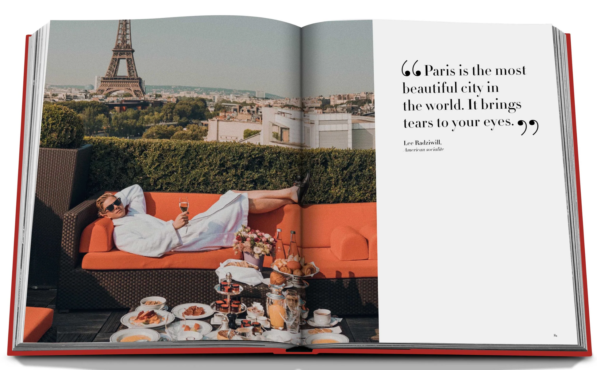 Open book featuring a man in a white robe lounging on an outdoor sofa at Plaza Athénée with a view of the Eiffel Tower, and an array of breakfast foods on a table. A quote about Paris appears on the right page, capturing the essence of French hospitality. The book is titled Plaza Athenee by Assouline.