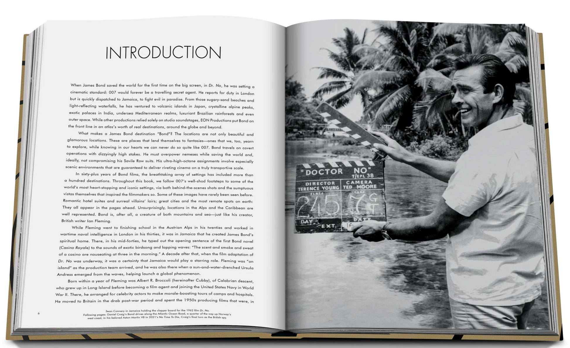 An open book featuring an image of a man holding a camera capturing iconic places, such as James Bond Destinations by Assouline.