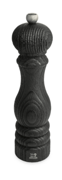 Paris Nature Black Wood Salt and Pepper Mill Collection crafted from French PEFC-certified wood, with intricate carvings and a textured surface, standing vertically on a white background. Brand Name: Peugeot Saveurs.