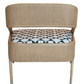 A Tenan Lounge Chair in Broadway with a curved back and a patterned cushioned seat featuring black, white, and grey geometric shapes. The chair has four wooden legs in a Matte Sand Dune finish, adding an elegant touch of West Palm Beach style. This exquisite piece is brought to you by McGuire Furniture.