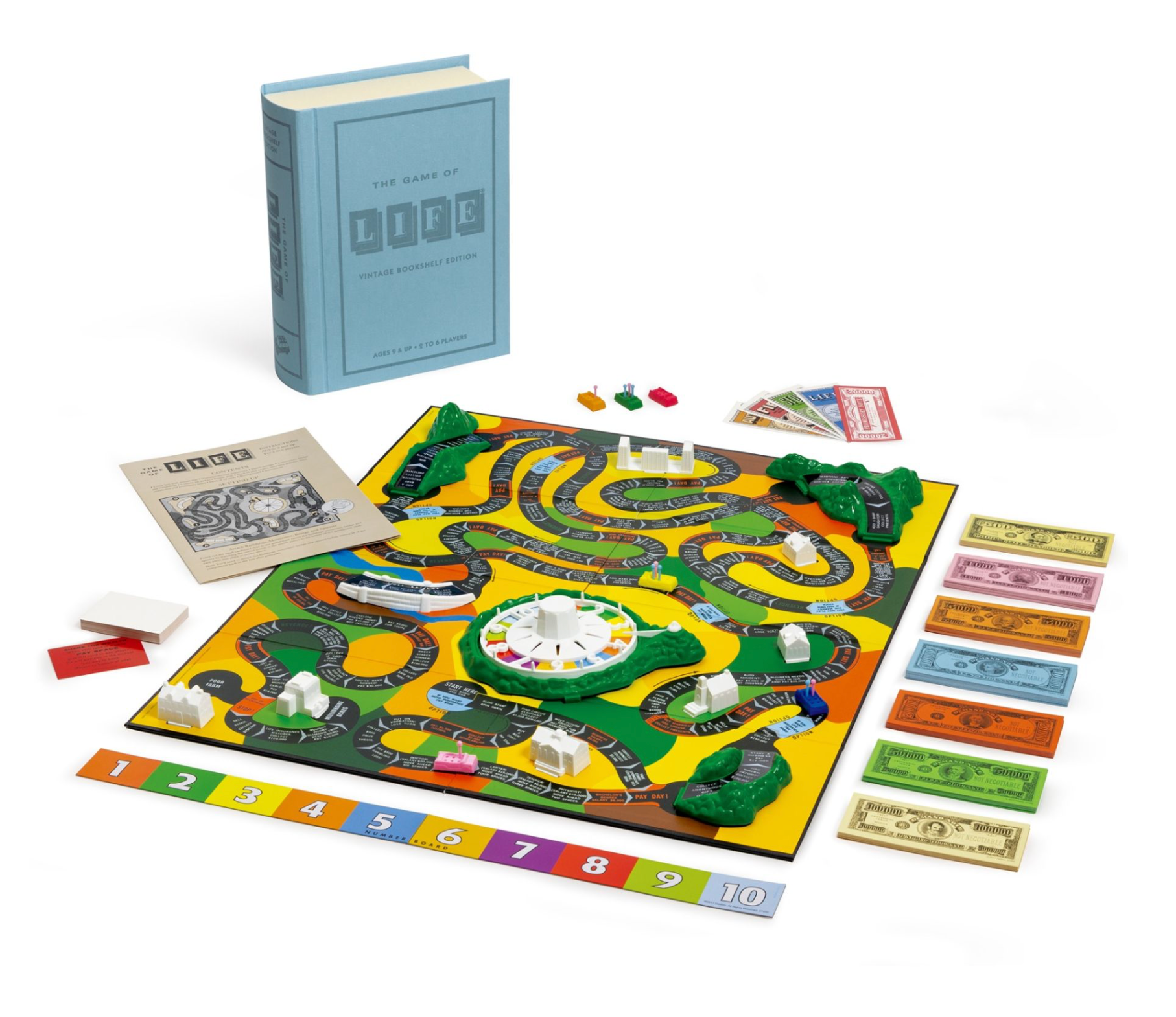 Image of "The Game of Life Vintage Bookshelf Edition" board game set up with the board, cards, spinner, play money, and game pieces. The WS Game Company game box and rule book are shown in the top left corner, featuring vintage graphics that add nostalgic charm to this classic setup.