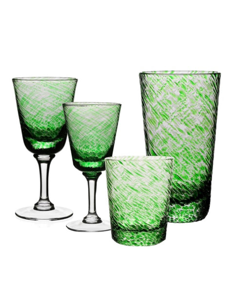 Five William Yeoward Crystal Vanessa Green Collection glass drinkware pieces, including two stemmed glasses and three tumblers, isolated on a white background.