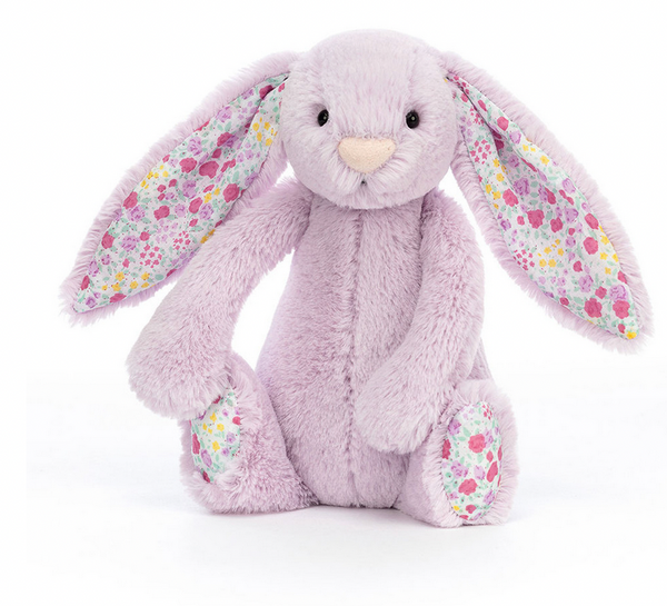 A small Jellycat Blossom Jasmine Bunny with floral patterns on its ears and feet sits facing forward against a white background.