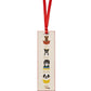 From Rifle Paper Co.'s Bookmark Collection, this cream-colored illustrated bookmark features four dogs in baskets, a red grosgrain ribbon, and the phrase "Sit. Stay. Read.