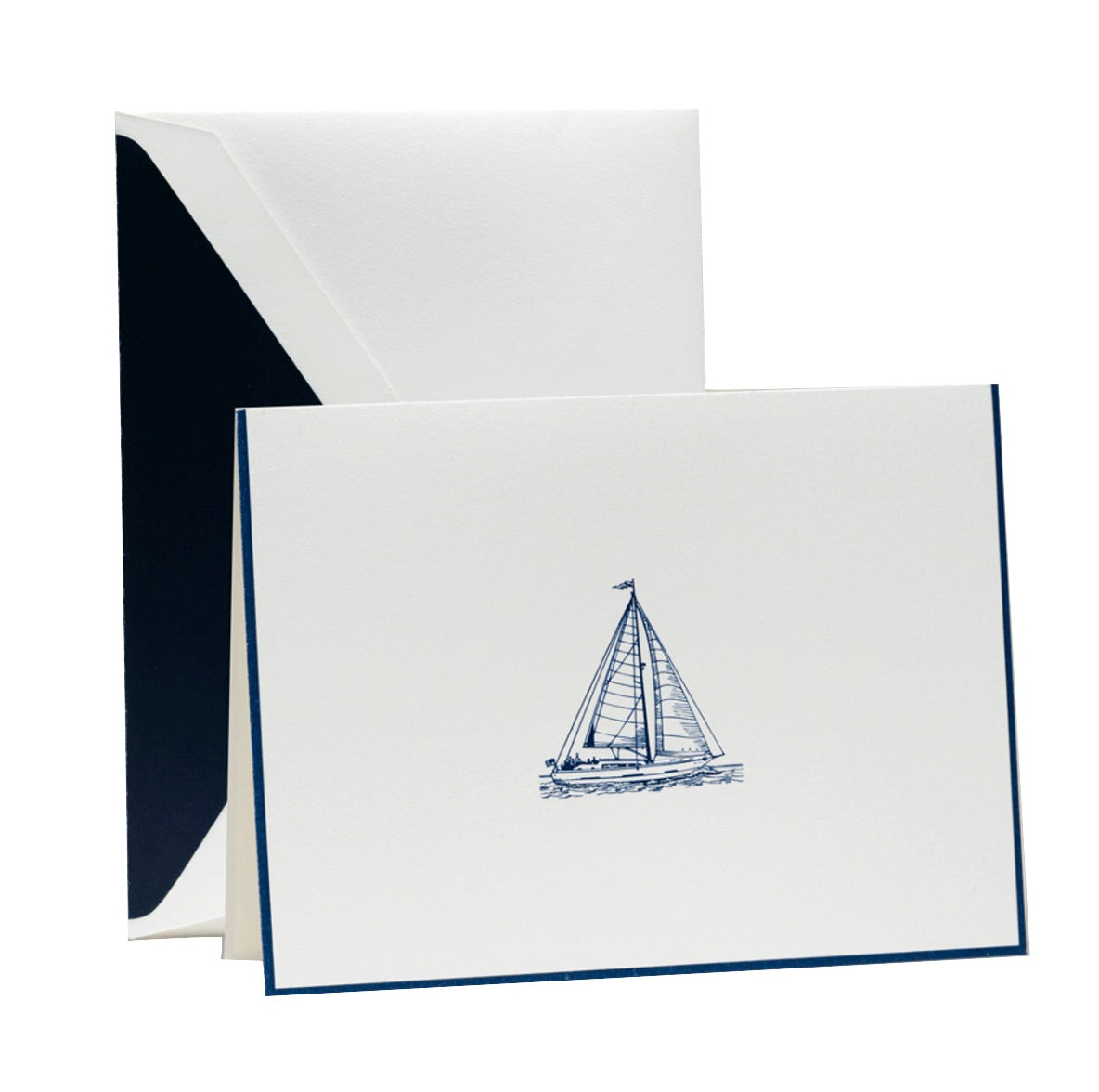 The Crane Sailboat Card Set features folded notecards with a simple blue engraved sailboat illustration and matching envelopes lined in dark blue—ideal for fans of luxury stationery.