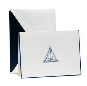 The Crane Sailboat Card Set features folded notecards with a simple blue engraved sailboat illustration and matching envelopes lined in dark blue—ideal for fans of luxury stationery.