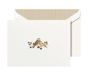 The Crane Love Bird Card Set features pearl white folded notes with two brown birds on branches, paired with matching envelopes and striped liners—crafted from premium cotton paper.