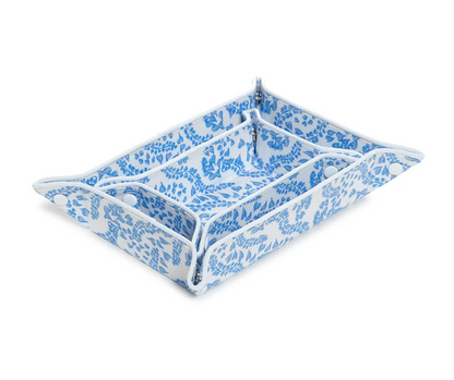 The TRVL Design Luxe Gloss All Heart Blue Travel Set features a rectangular tray with upturned corners and a blue-and-white floral pattern, perfect for organizing travel accessories, shown empty against a white background.