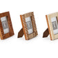 The Stacks Mini Frame Collection by Two's Company features three handcrafted mango wood mini photo frames with textured borders in brown, two-tone brown and white, and white, all displayed upright on a white background.