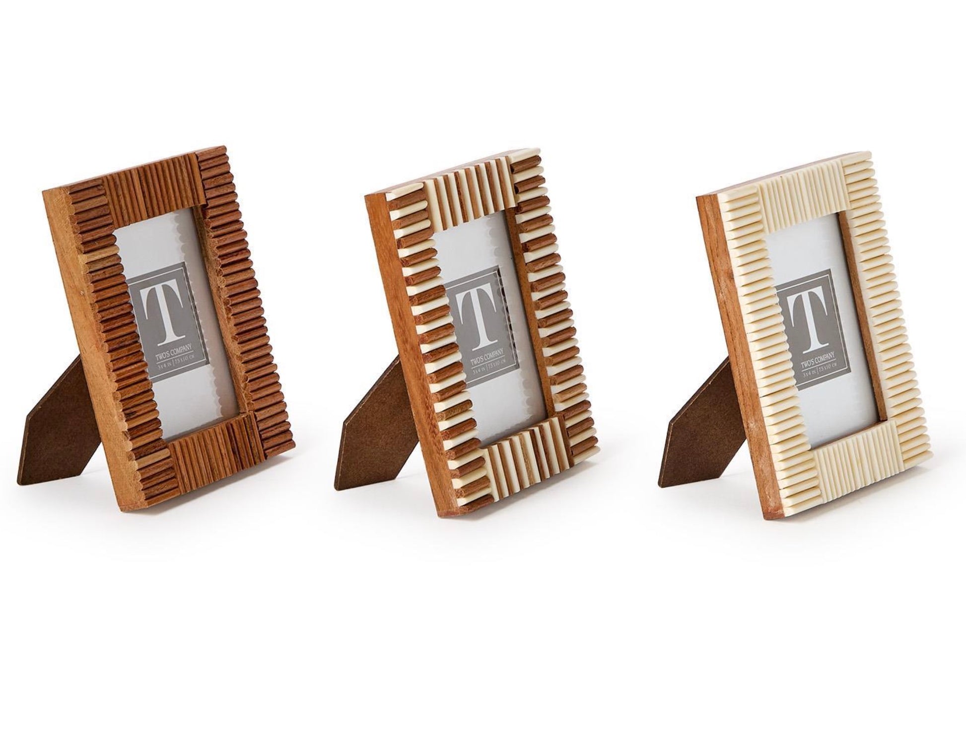 The Stacks Mini Frame Collection by Two's Company features three handcrafted mango wood mini photo frames with textured borders in brown, two-tone brown and white, and white, all displayed upright on a white background.
