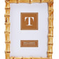 The Bamboo Natural Frame Collection by Two's Company features a timeless rectangular 5x7" photo frame with an eco-friendly bamboo-style design, a gold finish, and a "T" placeholder insert.