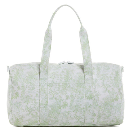 The TRVL Design Duffel Bag Weekender Collection features a water-resistant white duffel with a light green toile pattern, two handles, and a top zipper closure.