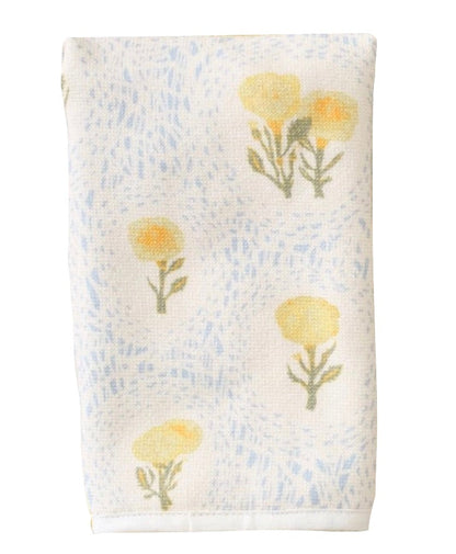 The Weezie x Lulie Wallace Louisa Powder Towel by Weezie Towels features yellow flowers and green stems on a light blue dotted background, crafted from absorbent cotton.