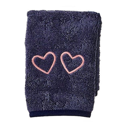The Weezie Towels Makeup Towel is a folded navy terry towel embroidered with two pink heart outlines, offering a stylish and stain-resistant solution for your beauty routine.