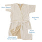 The Weezie Towels Short Plush Robe features beige and white stripes, an attached tie, plush velour exterior, absorbent terry interior, and two front pockets. Labels highlight its robe features.