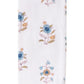 The HIVE Home, Gift and Garden Floral Scallop Cora Towel Collection features a folded white bath towel adorned with blue and yellow flowers for an elegant touch of luxury.
