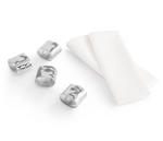 Four polished, hammered-metal napkin rings next to two folded cotton napkins from the Michael Aram Reflective Napkin and Napkin Ring Gift Set.