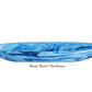 The "Boat Bowl Medium" from Nashi Home's Denim Resin Serveware Collection features shatter-resistant, blue marbled resin in a stylish, medium-sized boat shape—an elegant accent for your home decor.