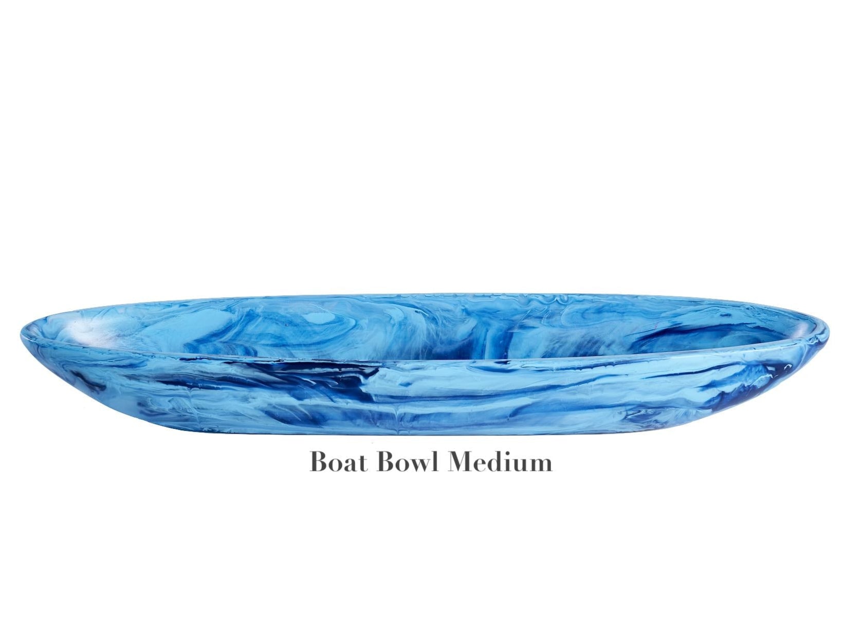 The "Boat Bowl Medium" from Nashi Home's Denim Resin Serveware Collection features shatter-resistant, blue marbled resin in a stylish, medium-sized boat shape—an elegant accent for your home decor.