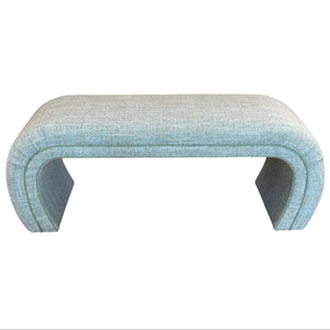 The O'Neal Bench in Rita Menthe by McCann Design Group features custom fabric, an elegant curved waterfall design with hidden legs, shown against a white background.
