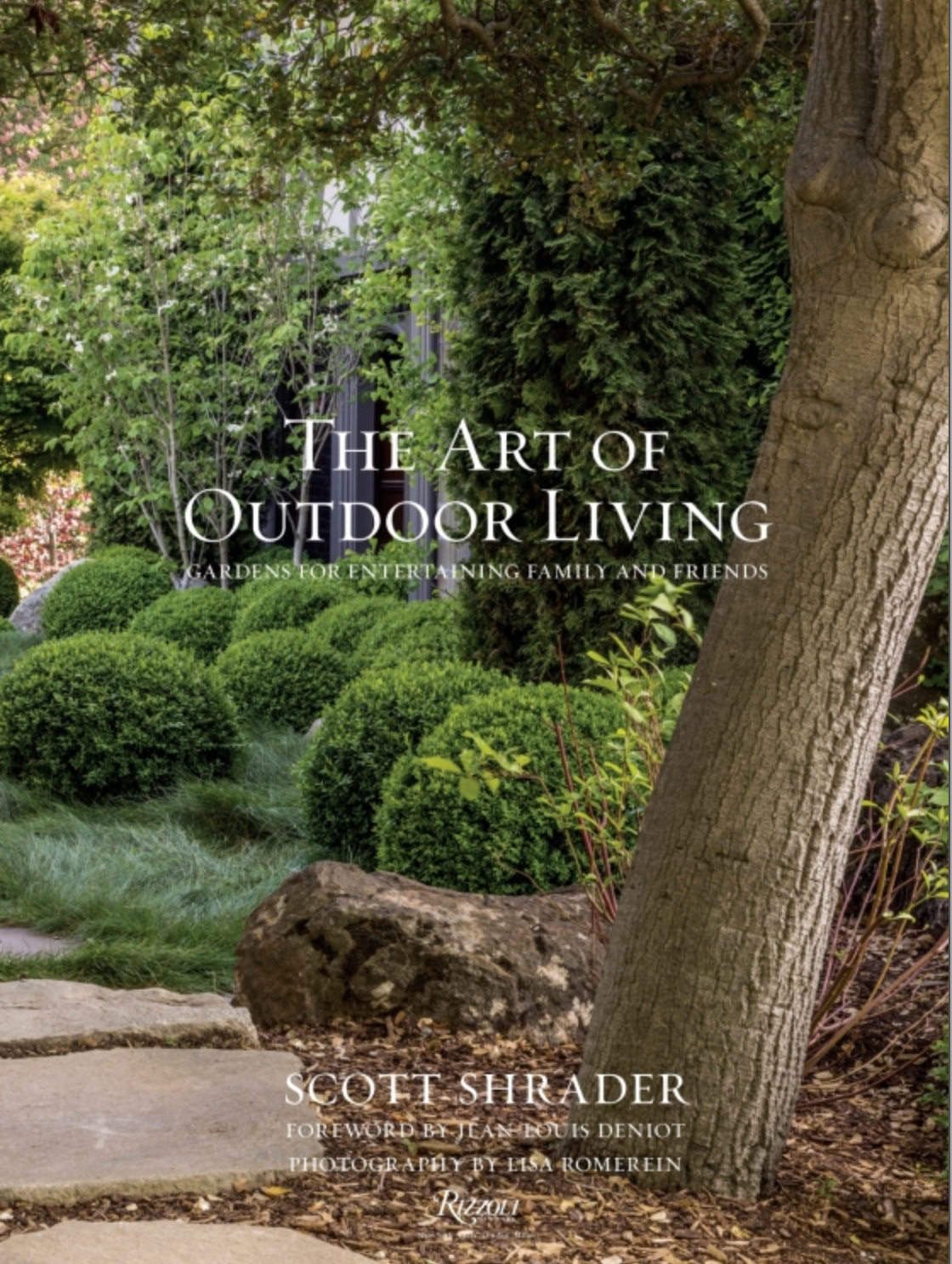 The book cover of “The Art of Outdoor Living” by Rizzoli features a beautifully landscaped garden scene with manicured bushes, lush greenery, mature trees, and elegant stone steps—an inspiring coffee table book ideal for anyone passionate about garden design and outdoor entertaining.