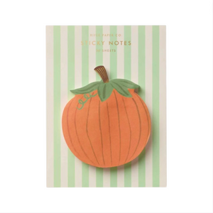 The Pumpkin Sticky Notes by Rifle Paper Co. feature a charming pumpkin shape with green leaves and are displayed on a white card with vertical light green stripes—perfect for adding a festive touch of fall to your workspace.