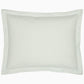 Part of the John Robshaw Cinde Bedding Collection, this rectangular pillow features a subtle, repeating green leaf pattern on a white background and a stitched border, designed to perfectly complement an organic sheet set.