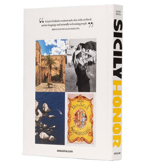The back cover of Assouline’s "Sicily Honor" coffee table book features a quote, three Sicily travel photos, and an ornate label, while the spine displays the title and author.