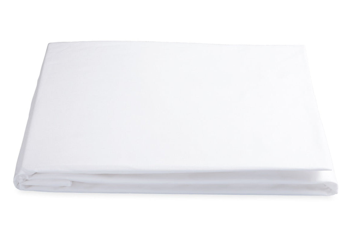 The Matouk White Sierra Fitted Sheet Collection, crafted from crisp 350 thread count cotton percale, is neatly folded and displayed on a plain white background.