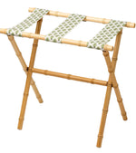 The Sorella Glenn Maple Luggage Rack, Highlands Pine, features three sturdy fabric straps with a green leaf pattern—perfect for stylish suitcase storage.