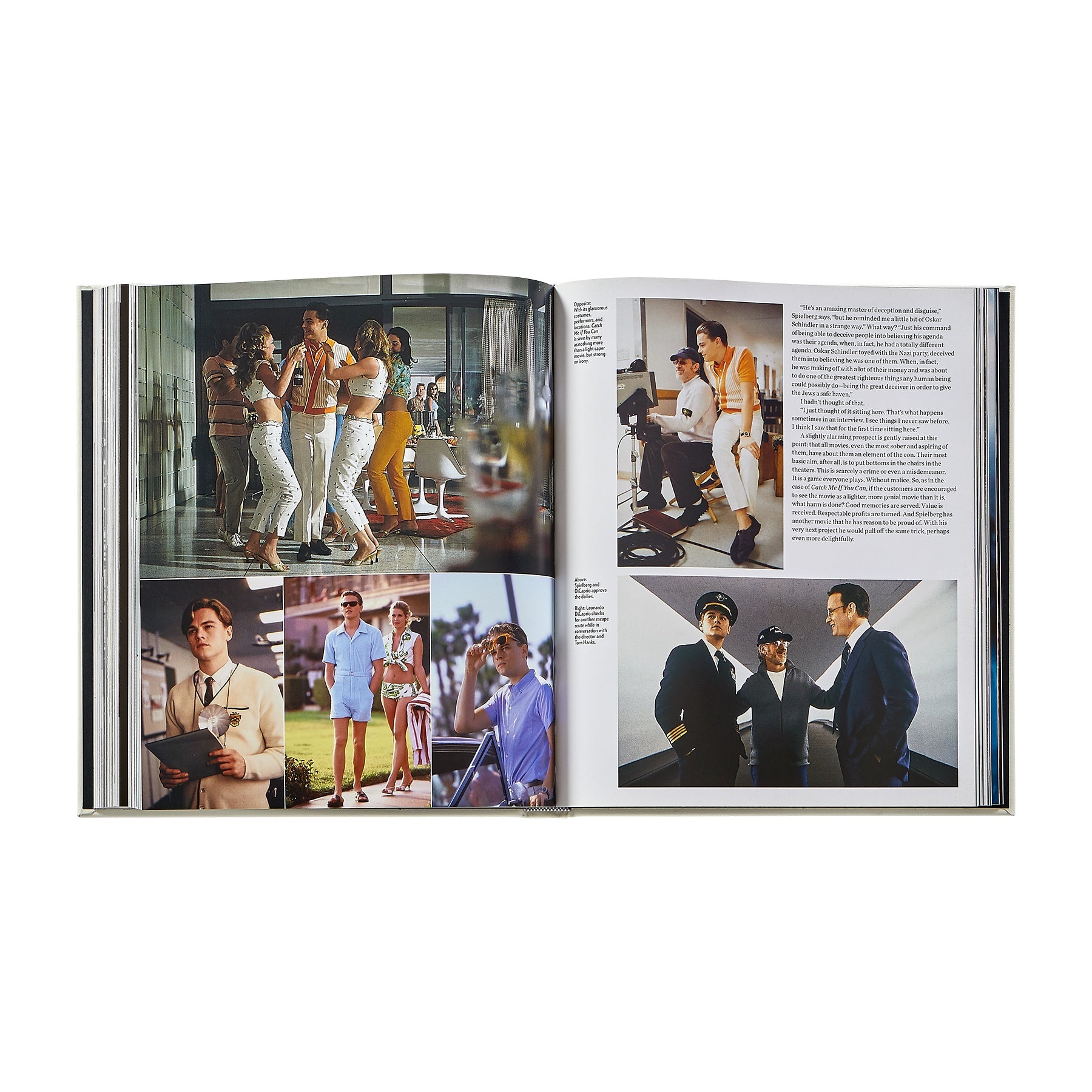 An open book, "Steven Spielberg: A Retrospective" by Graphic Image, shows color photos of people in stylish retro clothing—some solo, some in groups—with accompanying text on the right page.