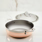 A Hestan CopperBond Copper Induction Dutch Oven, 5qt, with dual handles is shown on a white marble surface with its matching stainless steel lid resting behind it.
