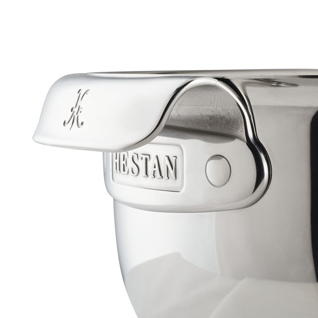 Close-up of a large capacity Hestan Provisions Stainless Steel Mixing Bowl, 7qt, featuring the engraved brand name on the handle and a polished, dishwasher safe metal surface.